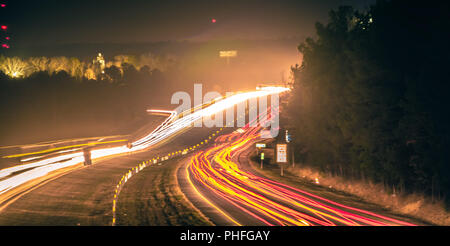 super highway with high volume of cars at night Stock Photo
