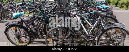 Bicycles in a parking lot Stock Photo