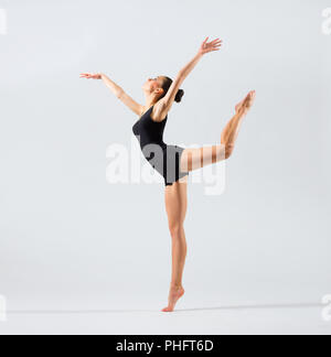 Young ballerina (on grey version) Stock Photo
