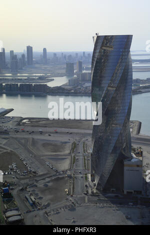 Twisted tower Wyndham Grand Manama in capital of Bahrain Stock Photo
