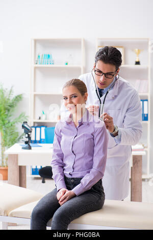 Patient visiting doctor for medical check-up in hospital Stock Photo