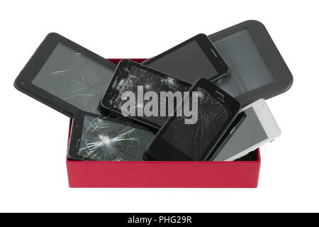 Broken gadgets in red box Stock Photo