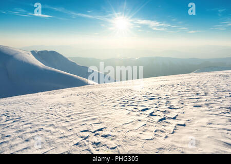 Sunset over hills and mountains Stock Photo