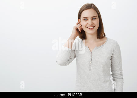 Friendly girl feeling shy in front of camera Stock Photo - Alamy
