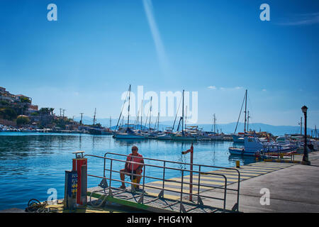 a pure blue sky and a blue sea hosted lots of small boats which refuges to Stock Photo