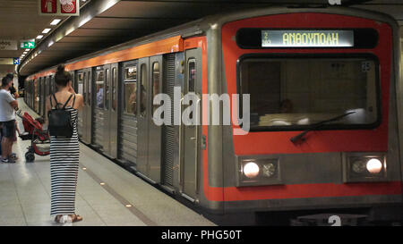 a red train an old train in the city of Athens Stock Photo