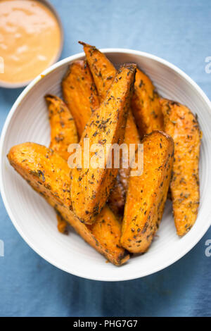 Sweet potato wedges with chilli mayo dip Stock Photo