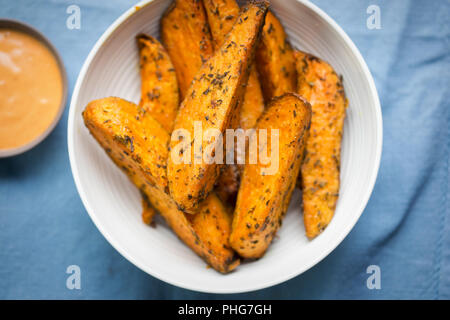 Sweet potato wedges with chilli mayo dip Stock Photo
