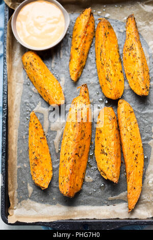 Sweet potato wedges with chilli mayo dip Stock Photo