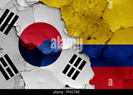 flag of South Korea and Colombia painted on cracked wall Stock Photo