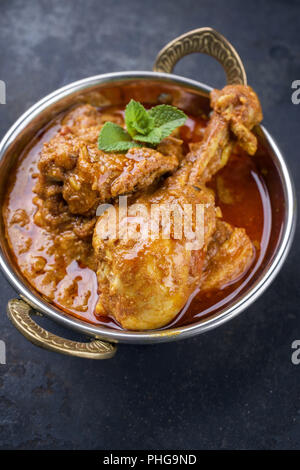 Chicken Handi in black bowl isolated on white background. Murgh Chicken ...