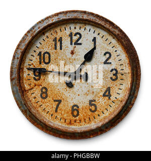 Very old worn and rusty round wall clock, isolated on white background Stock Photo