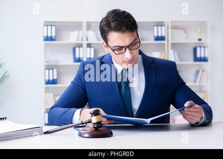 Young lawyer judge sitting in the office Stock Photo