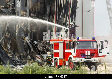 Large fire disaster in a warehouse Stock Photo - Alamy