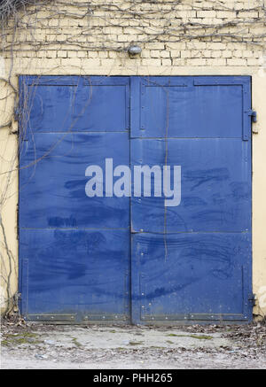 Locked blue gates Stock Photo