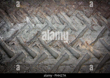 Tire tracks on a muddy road Stock Photo