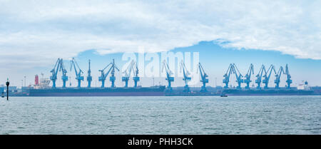 rotary suspension type cranes on seaport Stock Photo