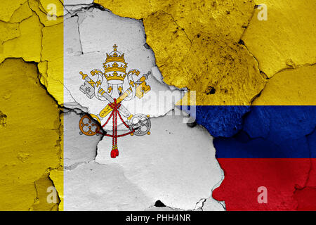 flag of Vatican and Colombia painted on cracked wall Stock Photo