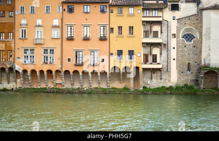 Ancient houses overlooking the Arno river in Florence Stock Photo