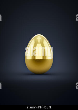 a golden easter egg with cross reflection on top Stock Photo