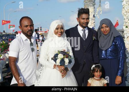 180901) -- MALE, Sept. 1, 2018 -- A Maldivian couple attend a mass