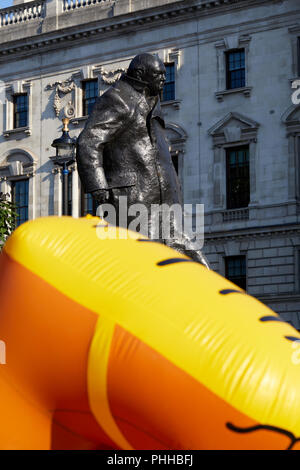 London, U.K. - 1 September 2018: The feet of a balloon mocking London mayor Sadiq Khan as it is inflated in front of the statue of Winston Churchill before being flown in Parliament Square at the Make London Safe protest. Credit: Kevin Frost/Alamy Live News Stock Photo