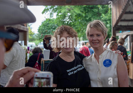 Ithaca, NY, USA. 1st September 2018. Cynthia Nixon (right), a Democratic candidate for governor of New York, poses with a supporter at the Ithaca Farmer's Market. Credit: Geoffrey Giller/Alamy Live News Stock Photo
