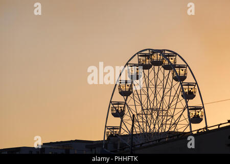 Bournemouth, Dorset, UK. 1st Sep 2018. UK weather: the sun sets silhouetting the big wheel, ferris wheel, at Pier Approach on the final dusk display of the Bournemouth Air Festival at the end of a lovely warm sunny day. Stock Photo