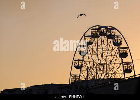 Bournemouth, Dorset, UK. 1st Sep 2018. UK weather: the sun sets silhouetting the big wheel, ferris wheel, at Pier Approach on the final dusk display of the Bournemouth Air Festival at the end of a lovely warm sunny day. Stock Photo