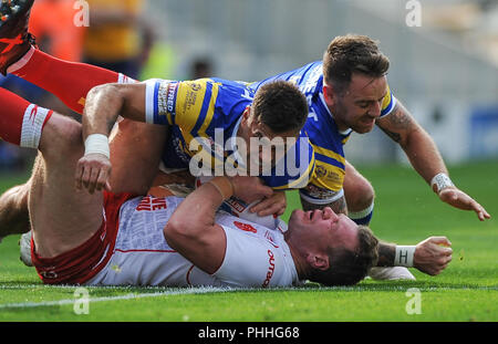 Emerald Headingley Stadium, Leeds, UK. 1st September 2018. Rugby League Super 8's Qualifiers Rugby League between Leeds Rhinos vs Hull Kingston Rovers; Matt Parcell and Richie Myler of Leeds Rhinos drop Hull Kingston Rovers Danny Tickle in a closely fought match.  Dean Williams Stock Photo