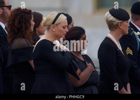Washington, District of Columbia, USA. 1st Sep, 2018. The family of Senator John McCain gathers to watch his casket depart the Capitol building for a memorial at National Cathedral. MEGHAN MCCAIN, center, John McCain's daughter, delivered a powerful speech at her father's funeral on Saturday, saying the 'America of John McCain has no need to be made great again because it was always great.' Credit: Michael Candelori/ZUMA Wire/Alamy Live News Stock Photo