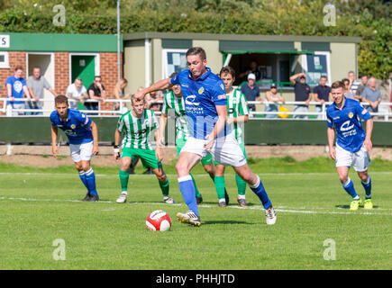 East Riding of Yorkshire, UK. 01 September 2018 - North Ferriby United A.F.C in the East Riding of Yorkshire, England, known as The Villagers and playing in green, hosted a match against Warrington Town AFC, known as The Yellows and The Wire and playing in blue, Both clubs play in the Evo Stik Northern Premier League Premier Division, the seventh tier of English football. Credit: John Hopkins/Alamy Live News Stock Photo