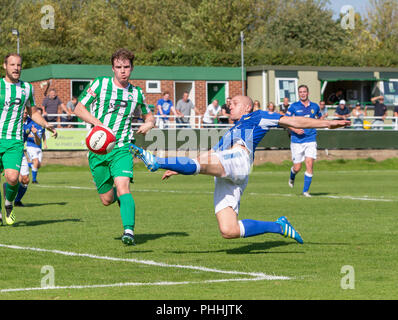 East Riding of Yorkshire, UK. 01 September 2018 - North Ferriby United A.F.C in the East Riding of Yorkshire, England, known as The Villagers and playing in green, hosted a match against Warrington Town AFC, known as The Yellows and The Wire and playing in blue, Both clubs play in the Evo Stik Northern Premier League Premier Division, the seventh tier of English football. Credit: John Hopkins/Alamy Live News Stock Photo