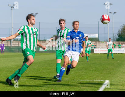 East Riding of Yorkshire, UK. 01 September 2018 - North Ferriby United A.F.C in the East Riding of Yorkshire, England, known as The Villagers and playing in green, hosted a match against Warrington Town AFC, known as The Yellows and The Wire and playing in blue, Both clubs play in the Evo Stik Northern Premier League Premier Division, the seventh tier of English football. Credit: John Hopkins/Alamy Live News Stock Photo