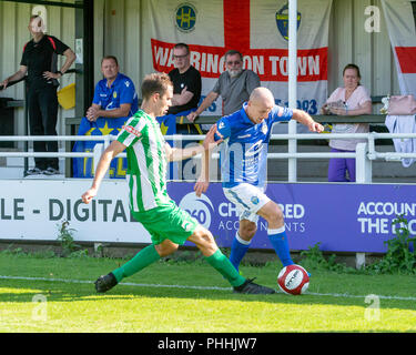 East Riding of Yorkshire, UK. 01 September 2018 - North Ferriby United A.F.C in the East Riding of Yorkshire, England, known as The Villagers and playing in green, hosted a match against Warrington Town AFC, known as The Yellows and The Wire and playing in blue, Both clubs play in the Evo Stik Northern Premier League Premier Division, the seventh tier of English football. Credit: John Hopkins/Alamy Live News Stock Photo