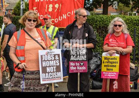 Worcester, Worcestershire, UK. 1st Sep, 2018. A woman see holding a poster.Members and supporters of the EDL (English Defense League) march through Worcester city, locals and antifascist groups gathered to protest against them. Credit: Jim Wood/SOPA Images/ZUMA Wire/Alamy Live News Stock Photo