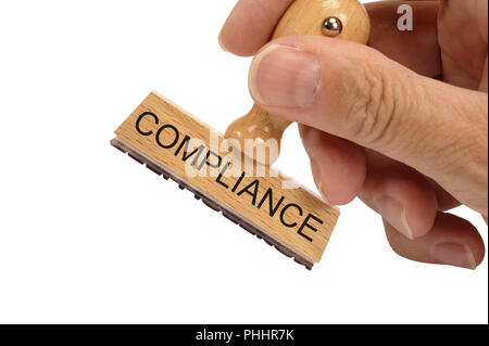 compliance printed on rubber stamp Stock Photo