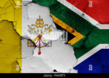 flag of Vatican and South Africa painted on cracked wall Stock Photo