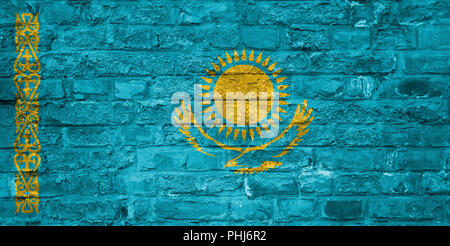 Flag of Kazakhstan over an old brick wall background, surface Stock Photo