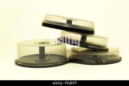 storages with spindel for compact disc. small capasity boxes with transparent covers in pile Stock Photo