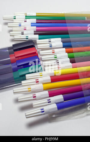 Premium Photo  Set of multi-colored pens isolated on a white background.