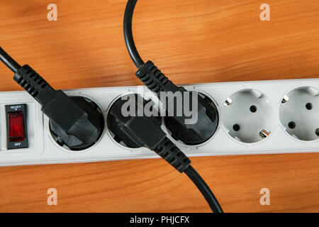 The electric extension piece with wires on table close up Stock Photo