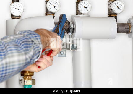 working on pipes Stock Photo