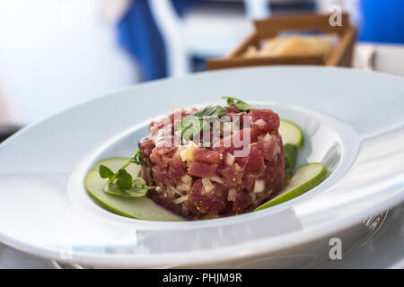 A plate of delicious tuna tartare with green apple Stock Photo