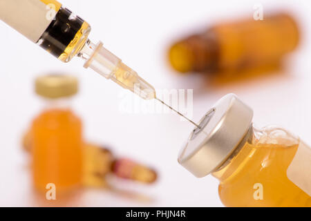 medical injection and vaccination with syringe and serum Stock Photo