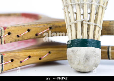 Old badminton accessories on a light table. Set for outdoor games and games. White background. Stock Photo