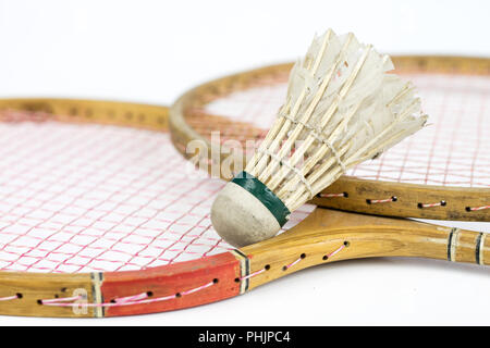 Old badminton accessories on a light table. Set for outdoor games and games. White background. Stock Photo