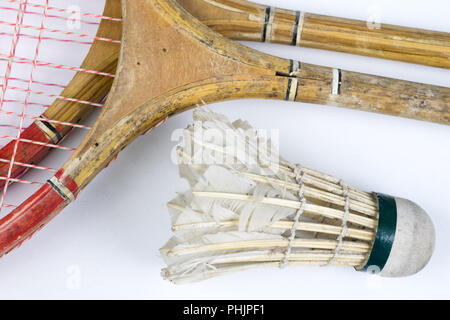 Old badminton accessories on a light table. Set for outdoor games and games. White background. Stock Photo