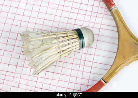 Old badminton accessories on a light table. Set for outdoor games and games. White background. Stock Photo