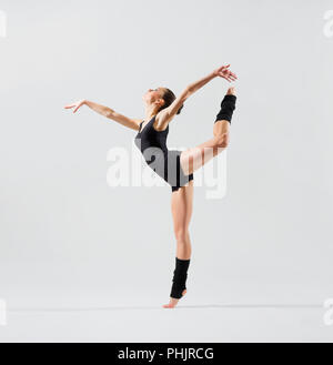 Young ballerina (on grey version) Stock Photo